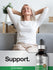 view 6 Woman relaxing on a couch with a bottle of Horbaach Slippery Elm Bark extract in front of her.