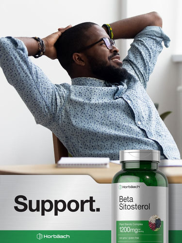 View 6 Man relaxing with a bottle of Beta Sitosterol supplement in front of him