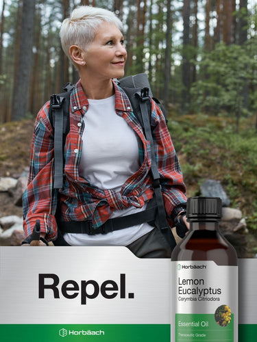 Woman hiking with a backpack in a forest, Horbaach Repel Lemon Eucalyptus essential oil bottle visible