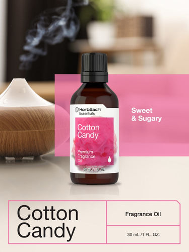 View 6 Bottle of Cotton Candy fragrance oil with a diffuser in the background.