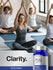 view 6 People practicing yoga in a studio with a bottle of PQQ supplement in the foreground.