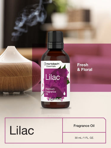 View 6 Bottle of lilac fragrance oil with a diffuser in the background.
