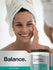 view 6 Woman with a towel on her head next to a container of Herb Bach Creatine Multi Collagen Powder