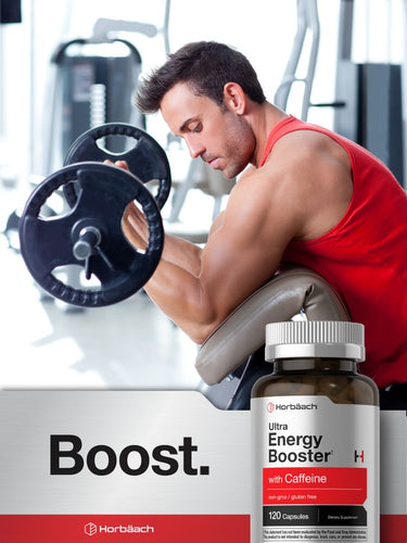 Man in red tank top sitting on a weight bench with a bottle of Ultra Energy Booster H in front, gym equipment in the background.