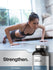 Woman doing push-ups in a gym with a bottle of calcium supplements in the foreground.