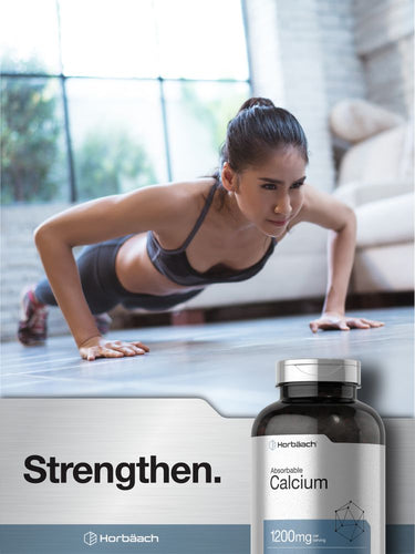 Woman doing push-ups in a gym with a bottle of calcium supplements in the foreground.