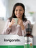 view 6 Woman holding a mug with a bottle of Horbaach Astragalus Root extract on a white background