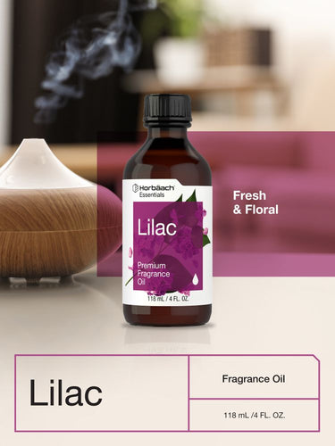 Bottle of lilac fragrance oil with a diffuser in the background.