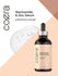 Coera Niacinamide & Zinc Serum bottle on a beige and brown background