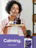 Woman holding a wooden board with essential oil bottles and a diffuser, with a calming text overlay.
