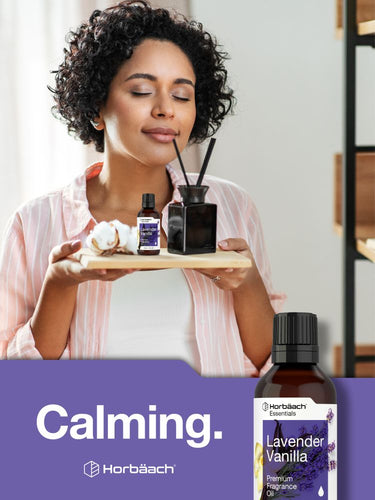 Woman holding a wooden board with essential oil bottles and a diffuser, with a calming text overlay.