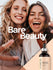 Two women smiling with a Coera skincare serum bottle on a 'Bare Beauty' background