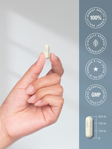 View 7 Hand holding a capsule with product details on a gray background