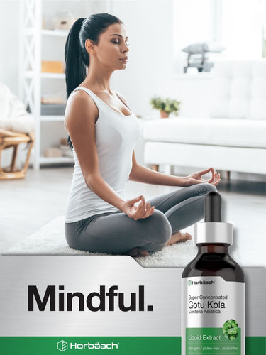 View 7 Woman meditating with a bottle of Horbaach Gotu Kola Liquid Extract on a white background