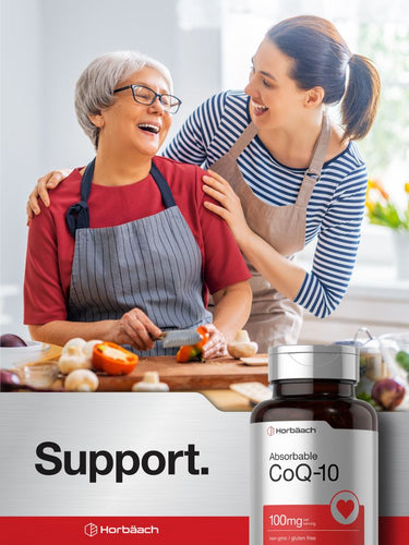 View 7 Two people in a kitchen with a bottle of CoQ-10 supplement in the foreground.