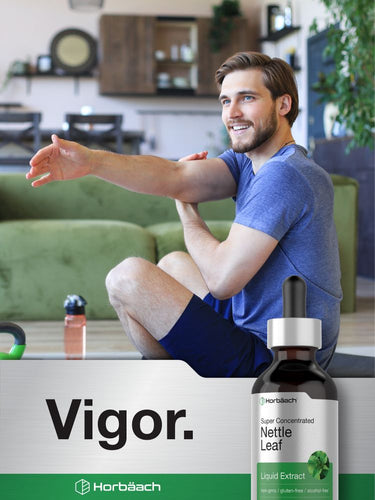 View 7 Man sitting on a couch with a bottle of Horbaach Nettle Leaf Liquid Extract in front of him, with 'Vigor' branding.