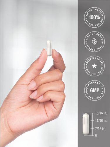 View 7 Hand holding a white capsule with certification logos on a gray background