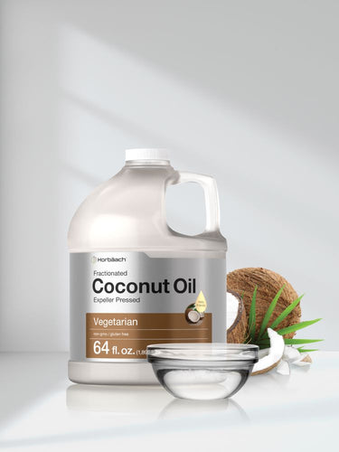 View 7 Container of coconut oil with a coconut and bowl on a white background