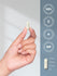 Hand holding a white capsule pill with product certification icons and text.