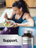 Woman eating a healthy meal with a bottle of Horbaach Probiotic-14 supplement in the foreground.