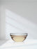 view 7 Glass bowl with liquid on a reflective surface against a white background