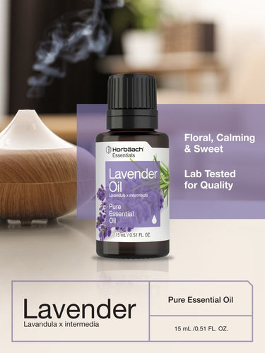 Bottle of lavender essential oil with a diffuser in the background