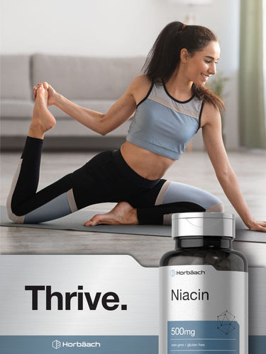 Woman doing yoga with a bottle of niacin supplement in the foreground.