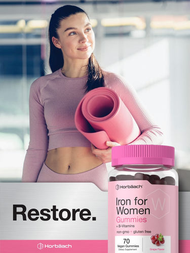 View 7 Woman holding a pink supplement bottle labeled 'Iron for Women' with a blurred background