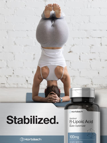 View 7 Person in a headstand with 'Stabilized' supplement bottle in the foreground