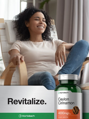 View 7 Person relaxing in a chair with a bottle of Ceylon Cinnamon supplement in the foreground.