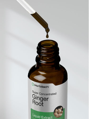 View 7 Bottle of ginger root liquid extract with dropper on a plain background