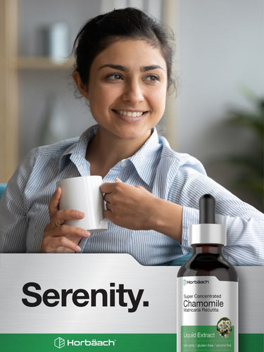 View 7 Woman holding a mug with a bottle of chamomile extract in the foreground.