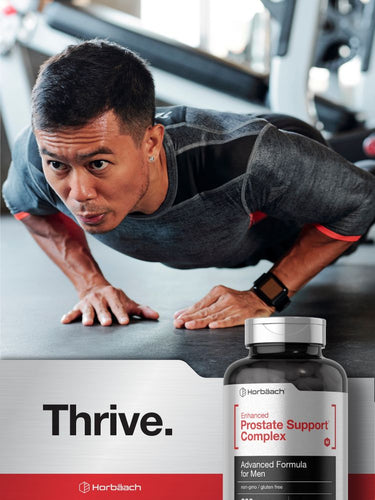 View 7 Man doing push-ups in gym with supplement bottle in foreground