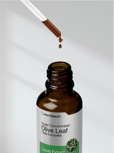 Brown bottle labeled 'Super Concentrated Olive Leaf' with dropper dispensing liquid.