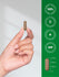 view 7 Hand holding a gold capsule with product details on a green background.