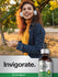 Woman with headphones holding a phone, standing outdoors with 'Invigorate' and Horbaach products displayed.