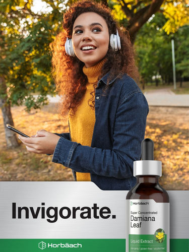 Woman with headphones holding a phone, standing outdoors with 'Invigorate' and Horbaach products displayed.