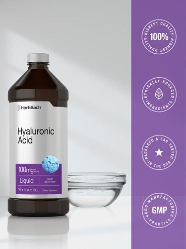 Hyaluronic Acid liquid bottle with a glass on a gray background