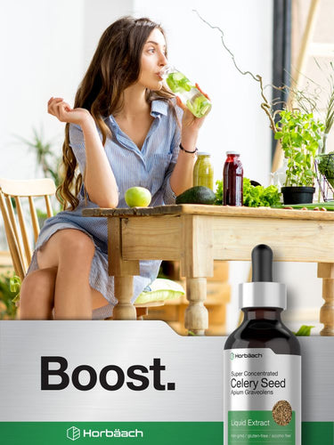 View 7 Woman sitting at a table with a bottle of Horbaach Celery Seed Liquid Extract in the foreground.