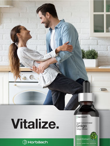 View 7 Couple embracing in a kitchen with a bottle of supplement labeled 'Vitalize'.