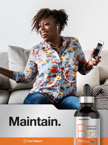 Person sitting on a couch using a smartphone with a bottle of vitamin supplement in the foreground.
