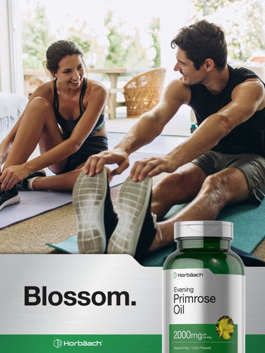 View 7 Two people on a yoga mat with a bottle of Evening Primrose Oil in the foreground.