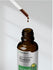 Bottle of Super Concentrated Rhodiola with a dropper on a gray background