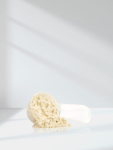View 8 White scoop with protein powder on a white background
