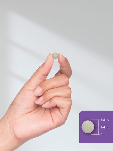 View 8 Hand holding a small beige tablet with a purple inset showing measurement details.