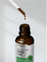 Bottle of Herbatach Nettle Leaf Liquid Extract with dropper on a light gray background