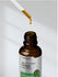 Bottle of Ginkgo Biloba liquid extract with dropper on a neutral background