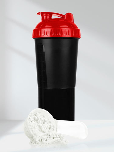 Black and red shaker bottle with white powder on a light background