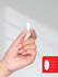 view 8 Hand holding a small white object with measurement scale on a plain background