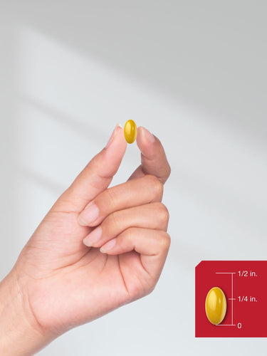 View 8 Hand holding a yellow pill with a red box inset showing dimensions.